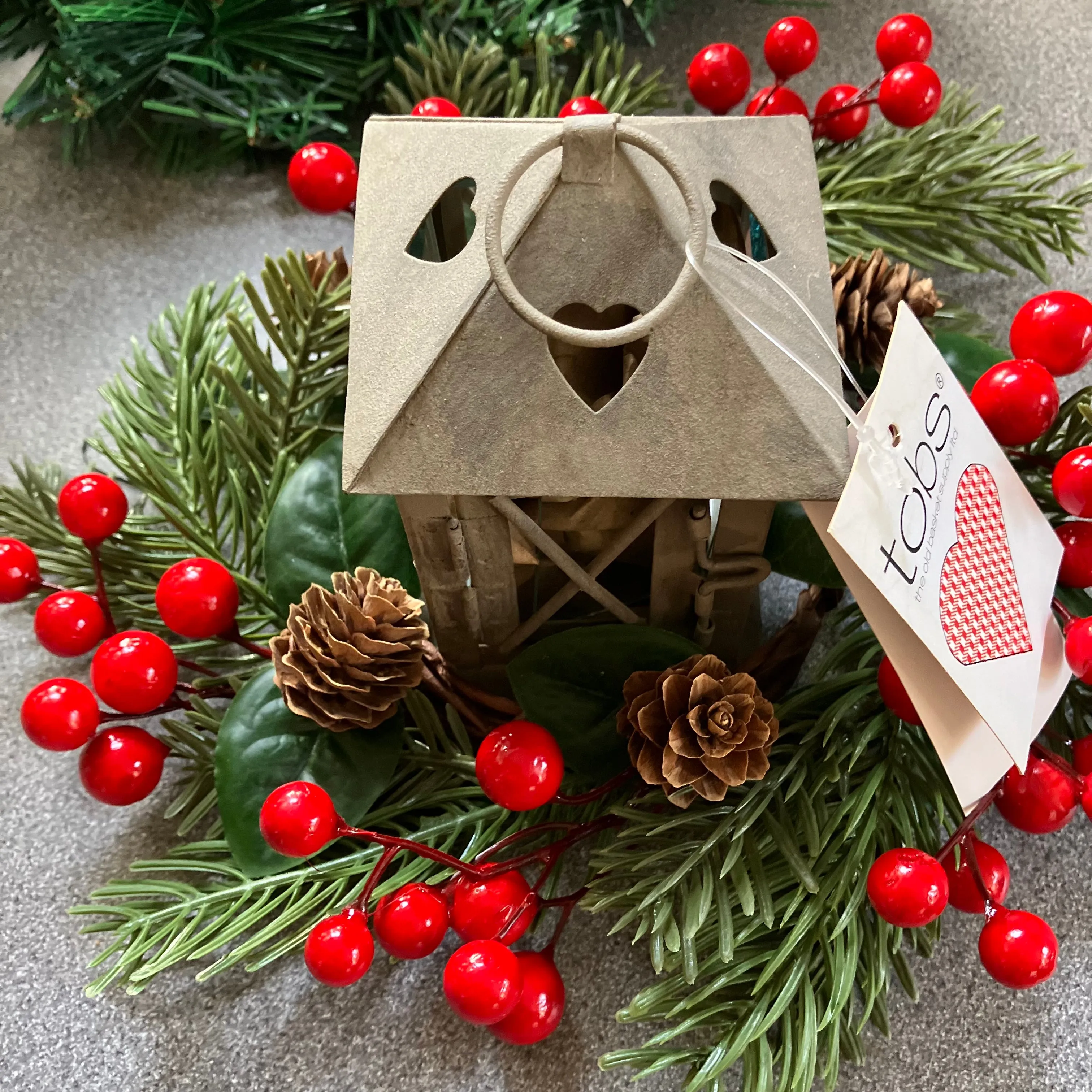 christmas candle ring and rustic lantern ideal as table centre