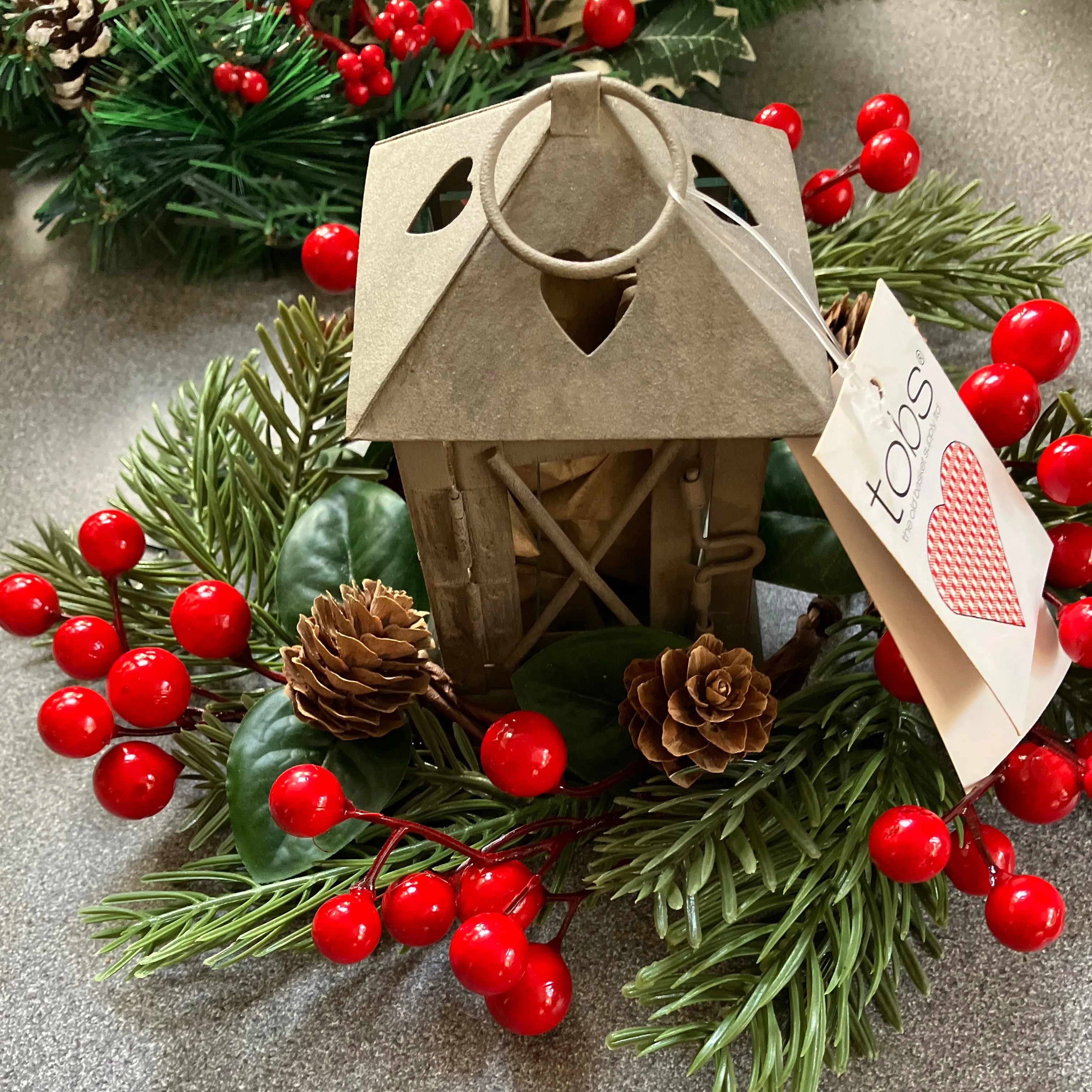 christmas candle ring and rustic lantern ideal as table centre